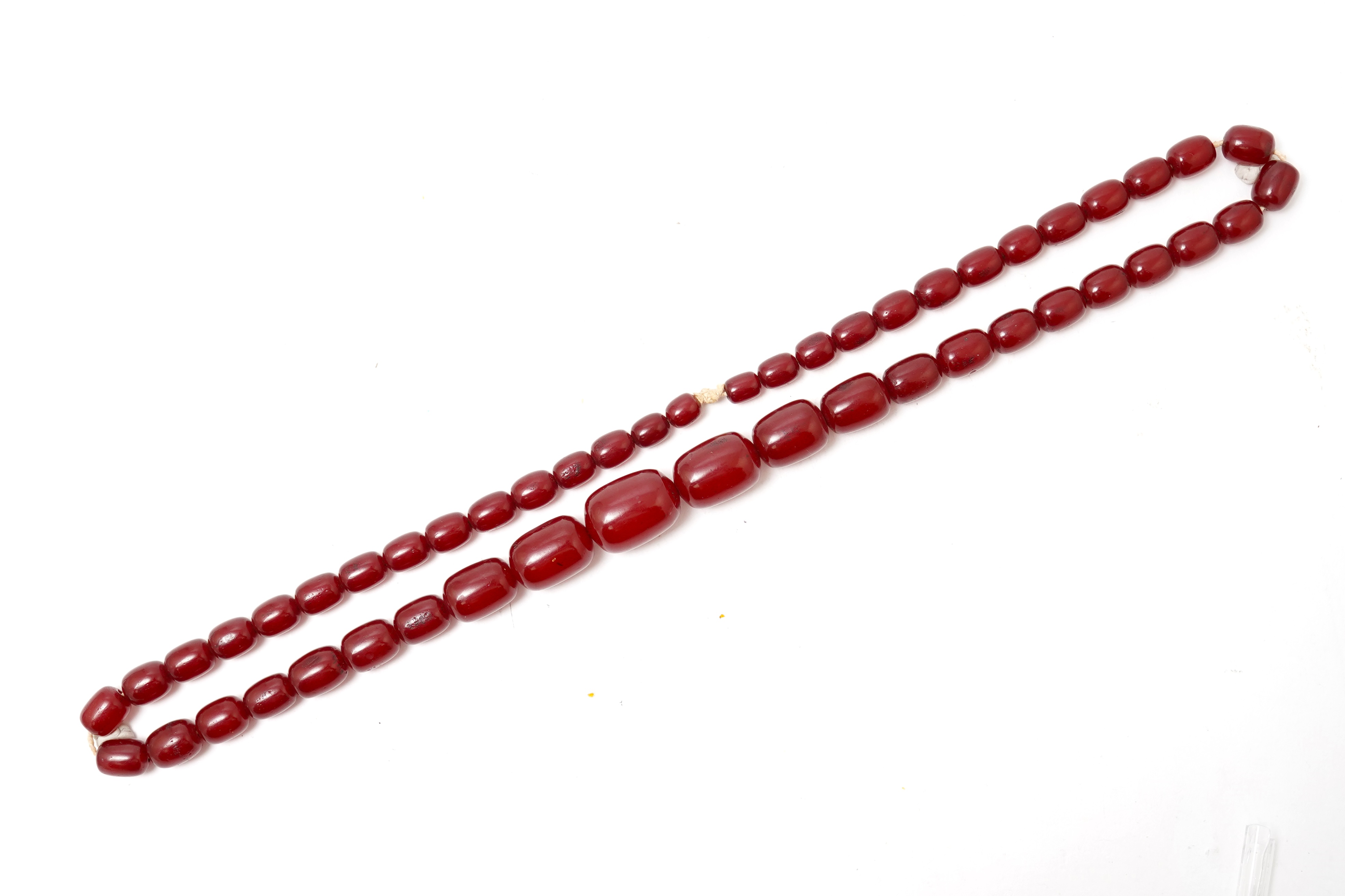 A cherry-coloured bakelite 'amber' necklace